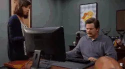 office worker throwing his computer in dumpster