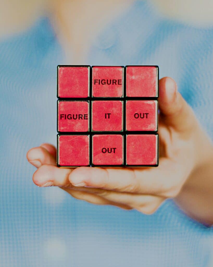 Figure it out written on red rubix cube