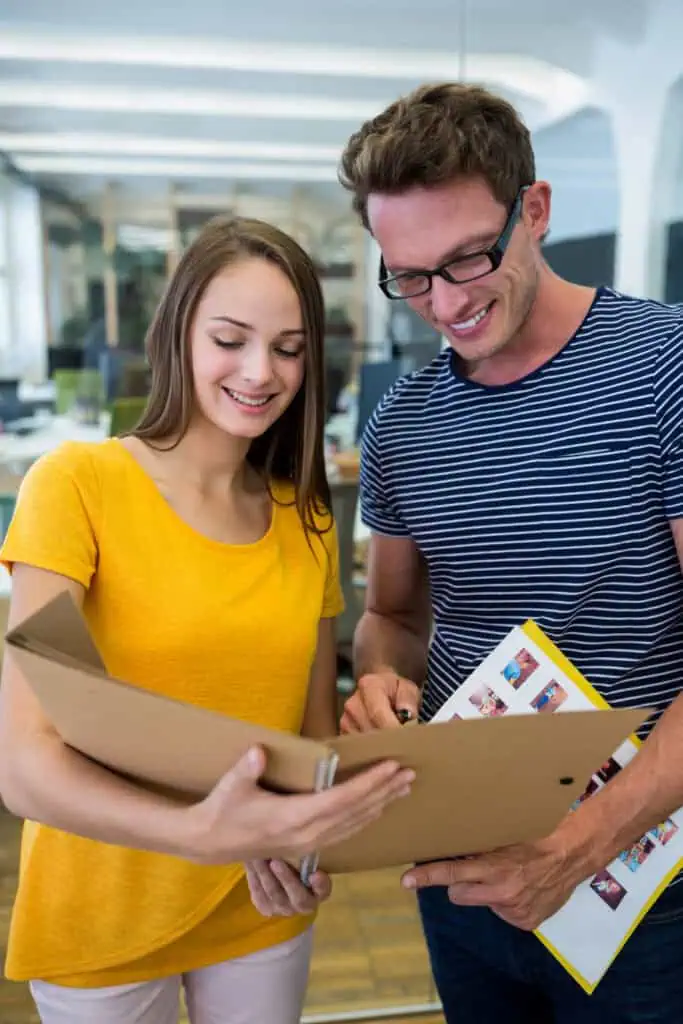 Relocation Consultants discussing a file