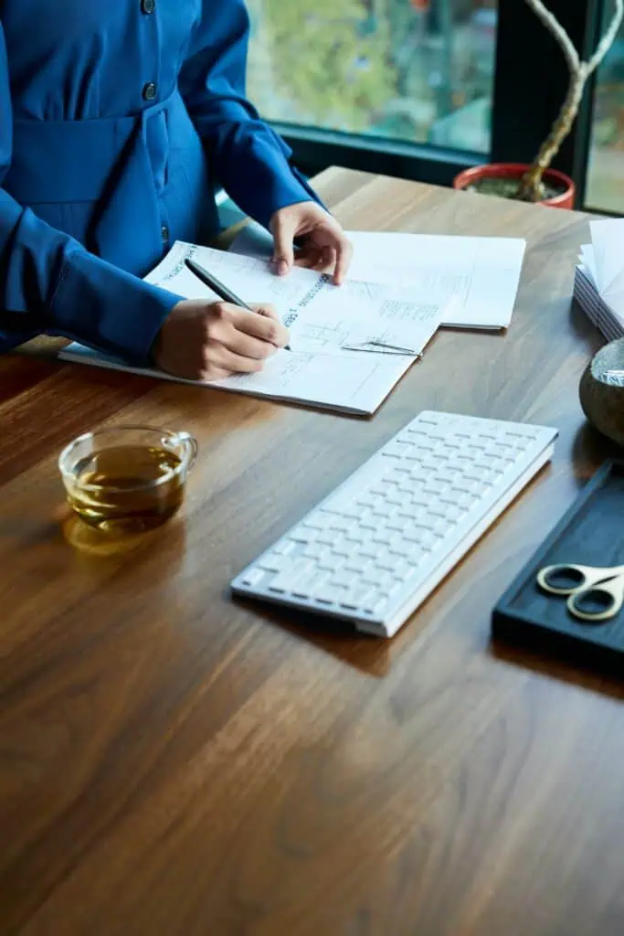 Person working at standing desk in office