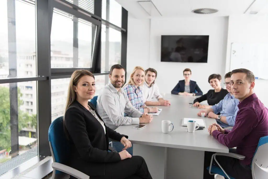 Group of interim marketing specialist having a meeting in well lit modern office room